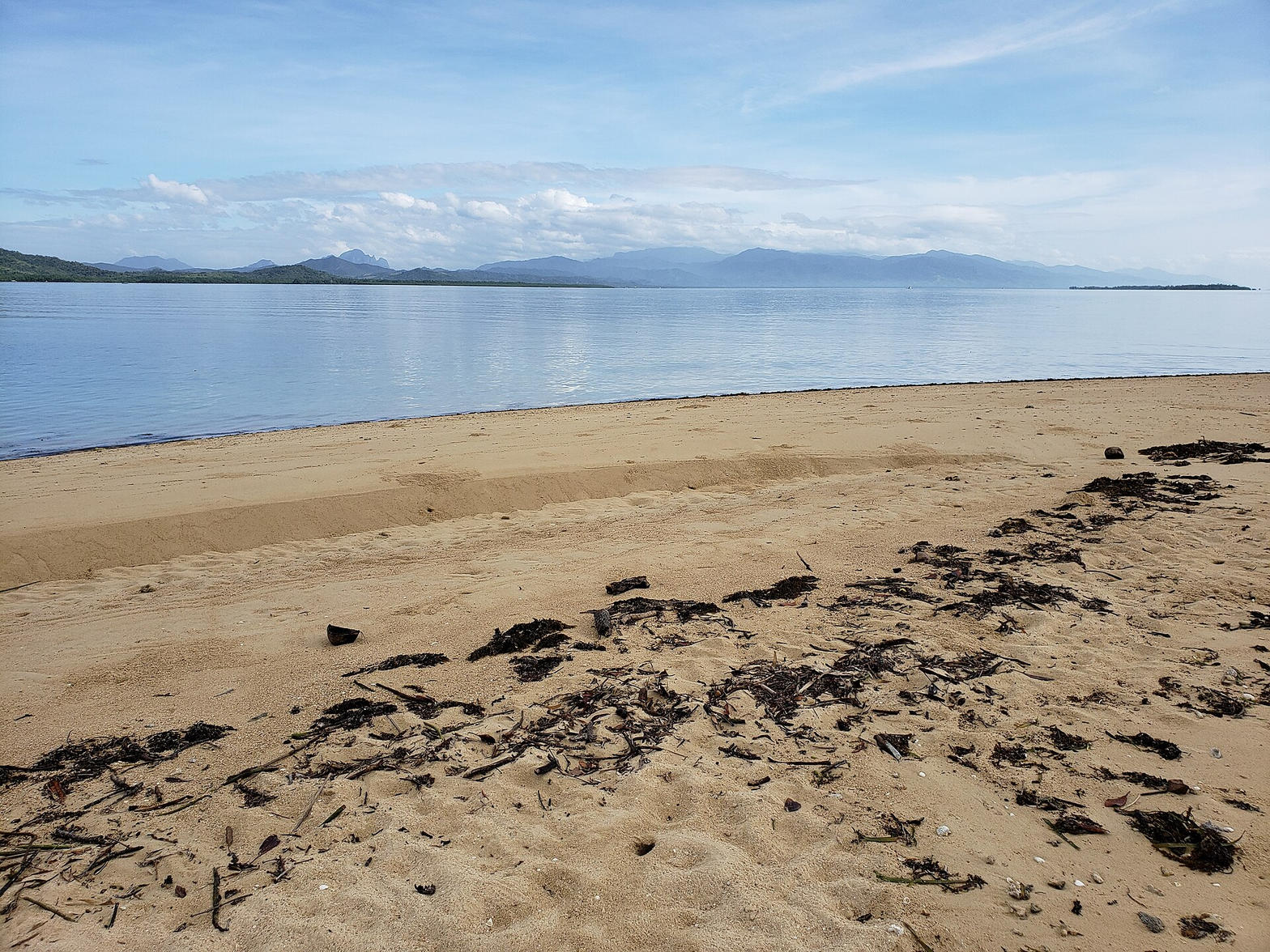 Quiet Honda Bay beach looking toward the mountains